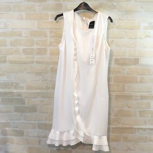White sleeveless dress.
